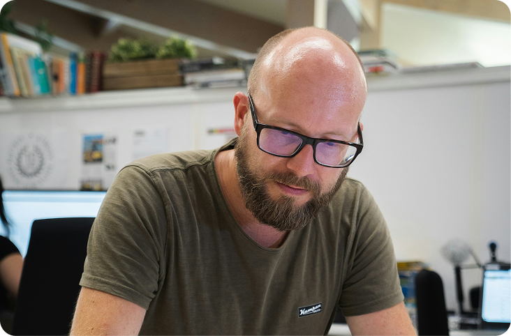 Bald man at desk
